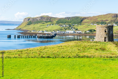 Uig harbour, pier and tower in the Isle of Skye in Scotland. photo