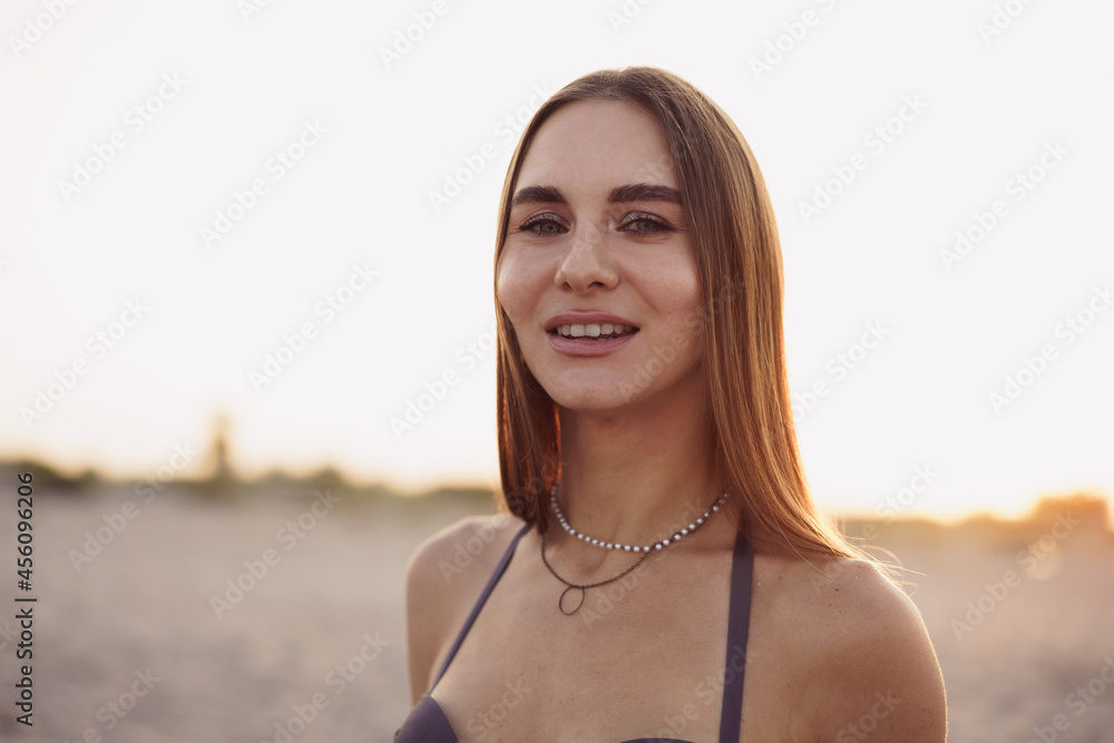 Photo of young attractive woman in bikini on beach Photo of young attractive woman in bikini on beach
