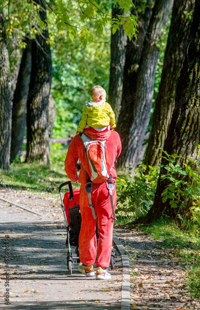 Father with her son walking in the summer Park
Father with her son walking in the summer Park