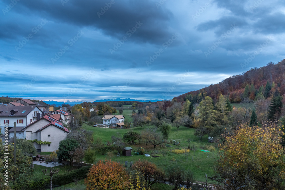 View of a typical Swiss countryside with cloudy sky