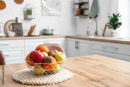 Basket with fresh fruits on...