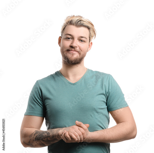 Non-binary young man on white background photo