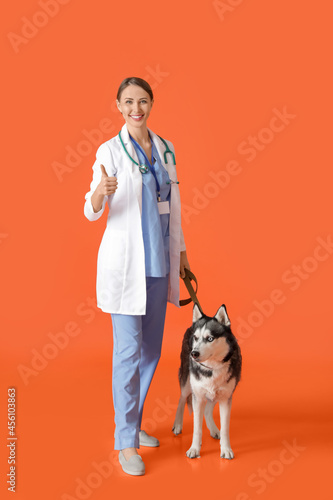 Veterinarian with cute dog ...