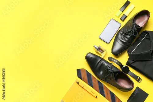 Set of stylish male accessories, mobile phone and classic leather shoes on color background