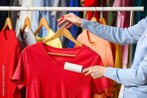 Woman cleaning red t-shirt ...