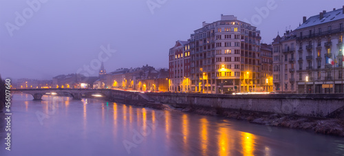 Image of night light of Grenoble near river in France outdoors.