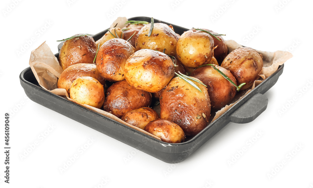 Frying pan with baked potatoes and rosemary on white background Frying pan with baked potatoes and rosemary on white background