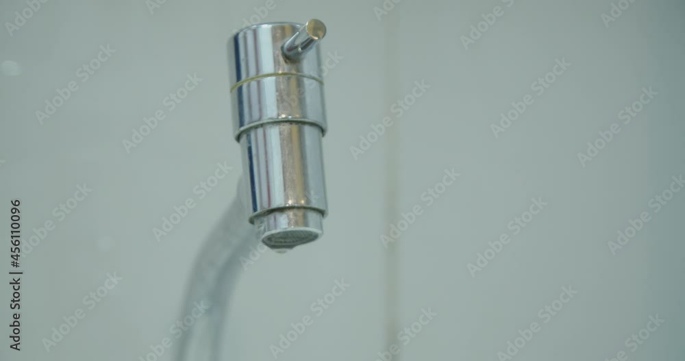 Dripping faucet. Bathroom water waste. Water waste concept. Water saving concept. Rationing and conscientious use.
Dripping faucet. Bathroom water waste. Water waste concept. Water saving concept. Rationing and conscientious use.