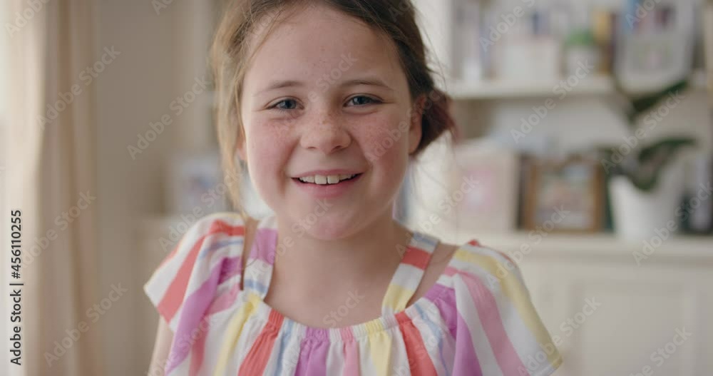 portrait beautiful happy girl with cute freckles smiling child looking at camera enjoying childhood happiness wearing colorful dress at home 4k portrait beautiful happy girl with cute freckles smiling child looking at camera enjoying childhood happiness wearing colorful dress at home 4k