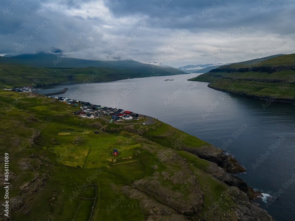 Beautiful aerial view of the Village of Eidi in Eysturoy next to Risin and Kellingin, the witch and the giant in the Faroe Islands