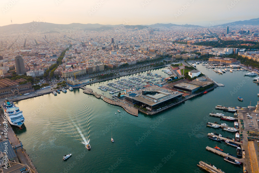 Image of aerial view of old port in Barcelona city with of sailboats and yachts