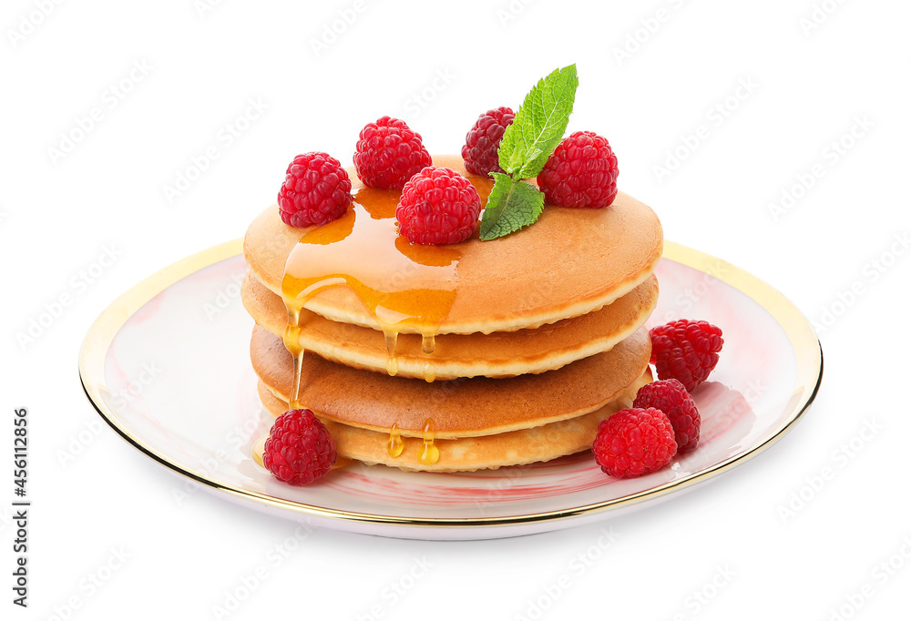 Plate of tasty pancakes with honey and berries on white background