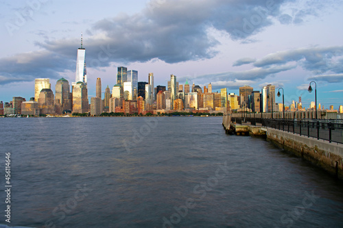 Late evening and nighttime view of financial district of Lower Manhattan from Liberty State Park on a partly cloudy day -01