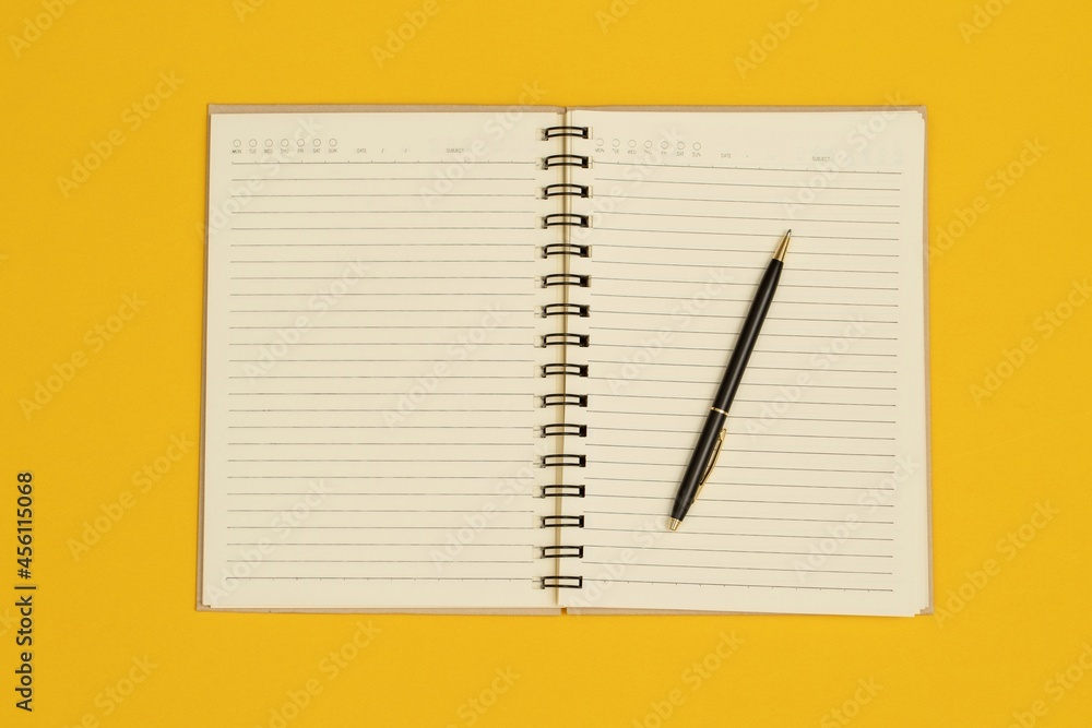 Notebooks and pens are used in the design of various publications. Notebooks and pens are used in the design of various publications.