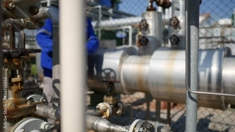 Industrial technician to check instrument equipment in steam pipeline in the industrial factory Industrial technician to check instrument equipment in steam pipeline in the industrial factory