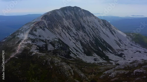 Mount Errigal, Derryveagh Mountains, Gortahork, County Donegal, Ireland, September 2021. Drone gradually orbits the north-western face with Dunlewy and Nacung Loughs in the distance. photo