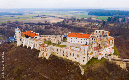 View from drone of destroyed historic castle complex on steep Vistulan hillside in Janowiec in spring day, Poland photo