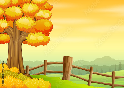 Autumn background with a big tree inside the fence