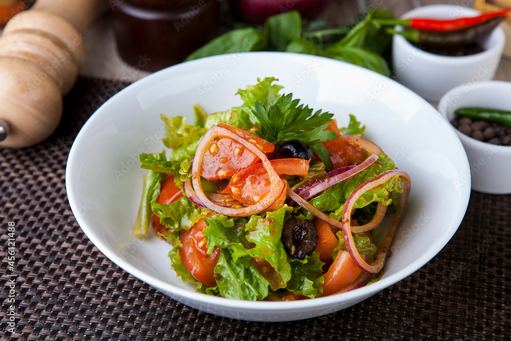 salad with greens tomatoes olives onions in a sweet sauce
salad with greens tomatoes olives onions in a sweet sauce