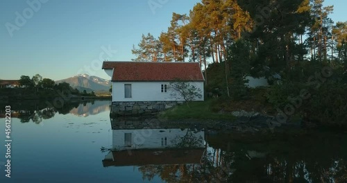 Unthinkably beautiful Norwegian landscape is revealed in this unique low level, relaxing, early morning aerial drone footage. photo