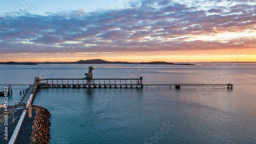 Horizontal shot of a wharf at sunset