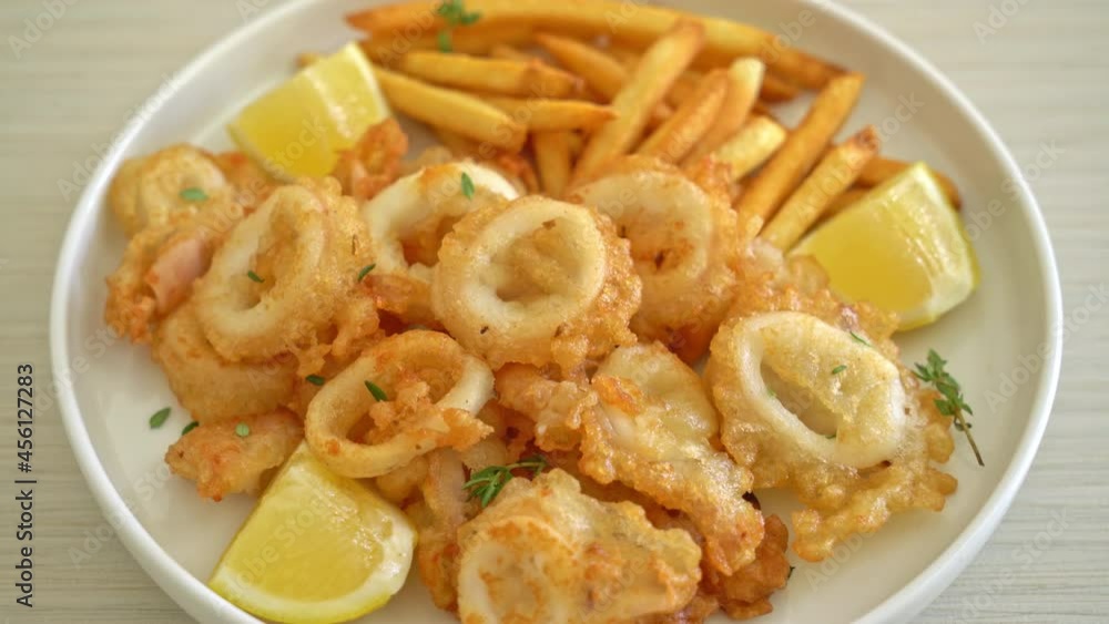 calamari - fried squid or octopus with french fries calamari - fried squid or octopus with french fries