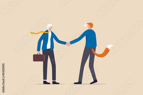 Dishonesty business deal, fraud or scam, liar to take advantage from partner, cheat or hunting for business victims concept, businessman handshaking with one as a sheep victim and one as hunter wolf. photo