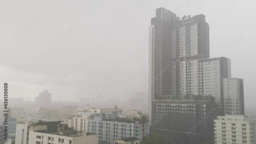 Severe Rainstorm with Tall Skyscraper Apartment Condominium in Bangkok, Thailand. Severe Rainstorm with Tall Skyscraper Apartment Condominium in Bangkok, Thailand.