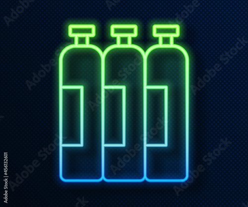 Glowing neon line Industrial gas cylinder tank for all inert and mixed inert gases icon isolated on blue background. Vector