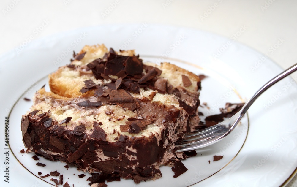 Eating chocolate cake with cream and chocolate chips Eating chocolate cake with cream and chocolate chips