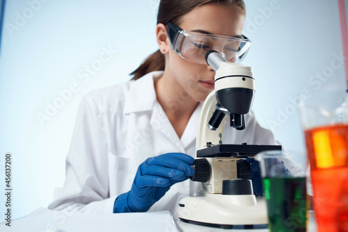 female doctor laboratory microscope science chemistry