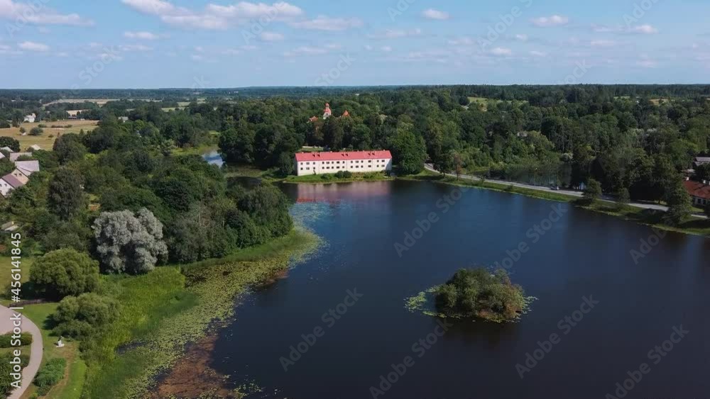 Aerial View of Edole Village, Edole Medieval Castle and Lake in Sunny Summer, Latvia, Courland (Kurzeme), Western Latvia. History, Architecture, Travel Destinations, National Landmark Aerial View of Edole Village, Edole Medieval Castle and Lake in Sunny Summer, Latvia, Courland (Kurzeme), Western Latvia. History, Architecture, Travel Destinations, National Landmark