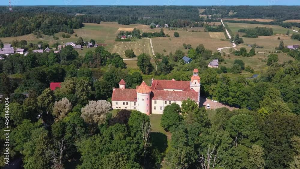 Aerial View of Edole Village, Edole Medieval Castle and Lake in Sunny Summer, Latvia, Courland (Kurzeme), Western Latvia. History, Architecture, Travel Destinations, National Landmark Aerial View of Edole Village, Edole Medieval Castle and Lake in Sunny Summer, Latvia, Courland (Kurzeme), Western Latvia. History, Architecture, Travel Destinations, National Landmark