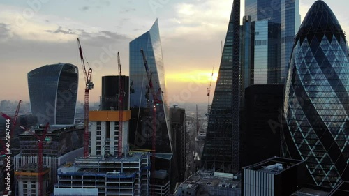 Aerial sliding shot of the Walkie Talkie, Scalpel, Cheesegrater, 22 Bishopsgate and the Gherkin buildings in London at sunset photo