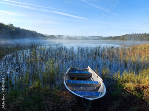 boat on the lake in a foggy morning in sweden