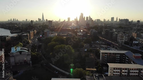 Reverse aerial view of London skyline silhouette at sunset photo