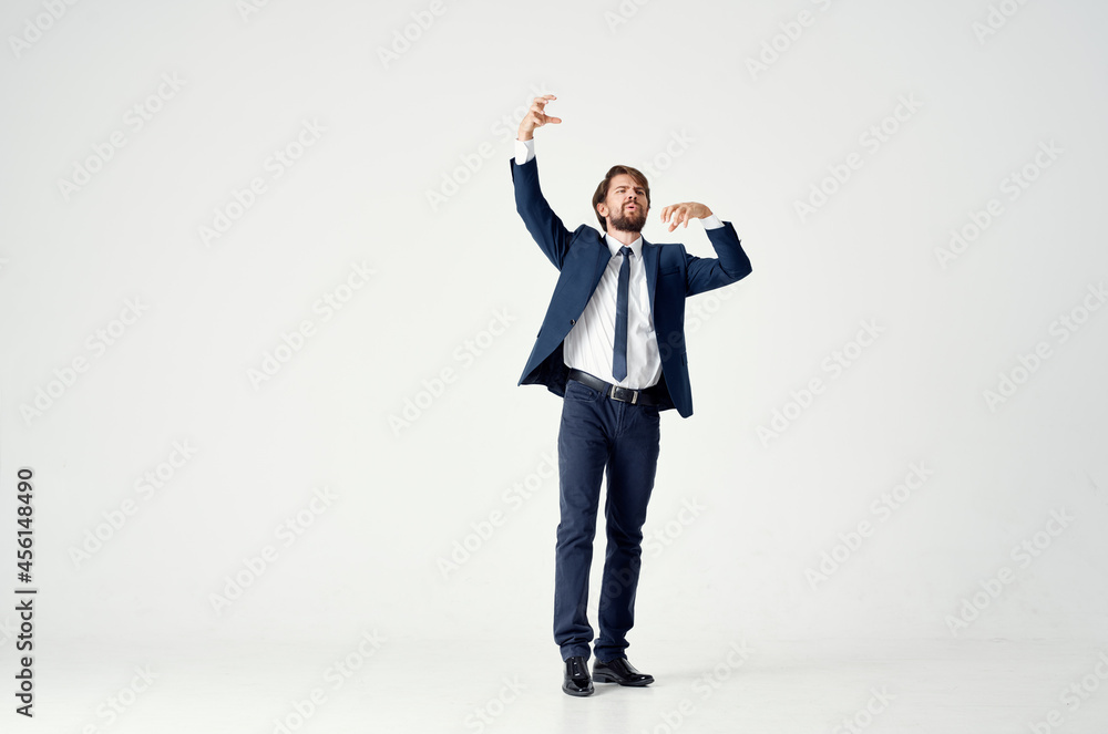 man in a jacket and tie posing executive light background man in a jacket and tie posing executive light background