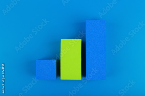Multicolored graph diagram or performance chart with rise dynamic against blue background. Chart for marketing  annual or corporate report  sales or growth evaluation or analytic or profit growing