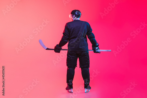 Canvas Print Back view full-length image of professional hockey player in uniform isolated ov