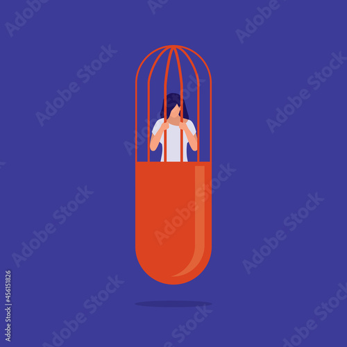 Drug Addiction Concept. Young Drug Addict Woman Trapped Inside A Prisoner Cage That Shaped Like A Pill Capsule. MDMA, Ecstasy, Molly Addiction.