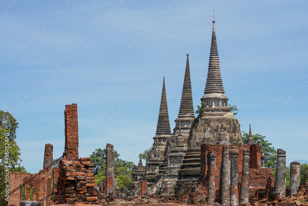 view to Wat Phra Si Sanphet temple in Ayutthaya historical park and temple bricks wall ruins remains, Ayutthaya, Thailand that the destination attractive tourists both Thai and foreigners