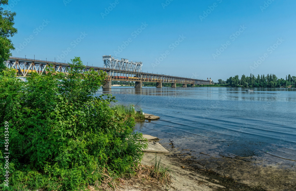 Old metal bridge across the Dnieper River in Eastern Europe, Ukraine