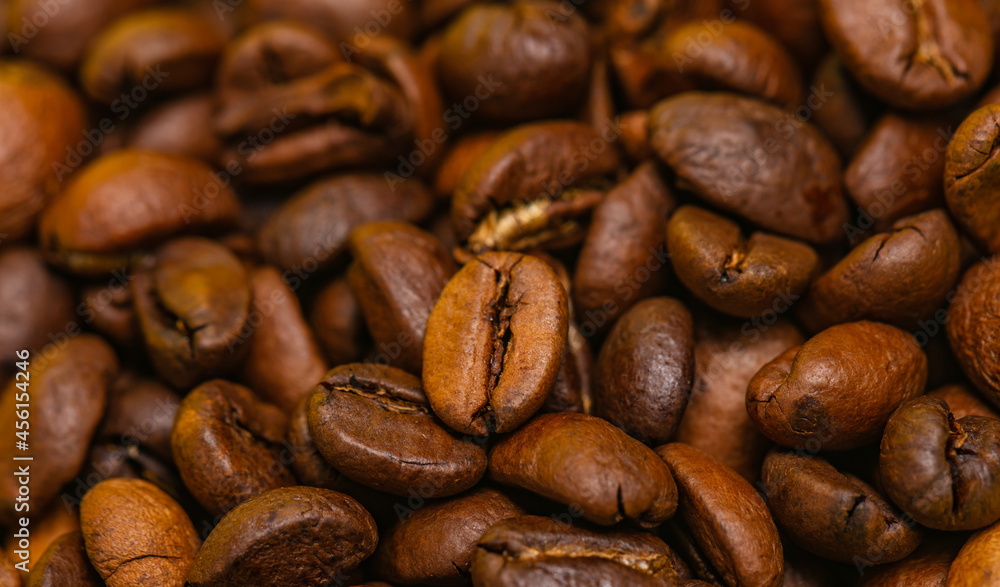 Freshly roasted coffee beans background Freshly roasted coffee beans background