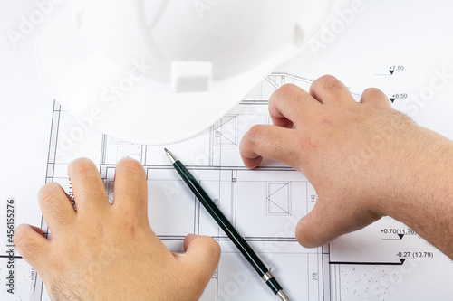 Man angry about architectural plan with hand gestures