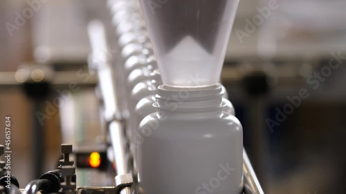 Pharmaceutical production. Medical capsules are moving in a packaging machine.