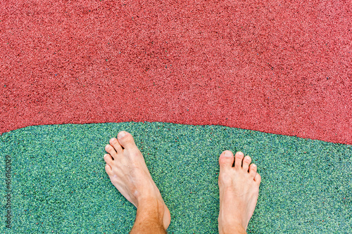 Barefoot on rubber flooring. Sports field covering. Sports field granules. Sportplatzbelag. Sportplatz Granulat. Barfuß auf Gummibelag.