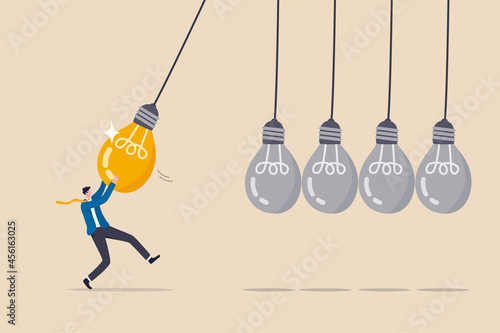 Knowledge sharing or skill transfer to inspire team, idea or creativity to motivate people or career improvement concept, businessman manager pull bright lightbulb as pendulum to transfer knowledge.