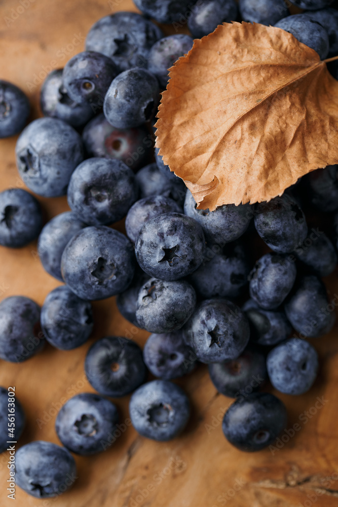 Blueberry or bilberry, fresh berry on wood background Blueberry or bilberry, fresh berry on wood background