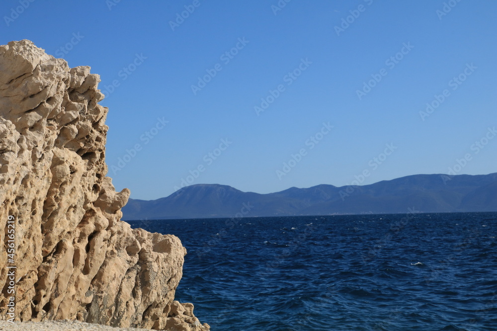Adriatic sea coast in summer with rocks and water