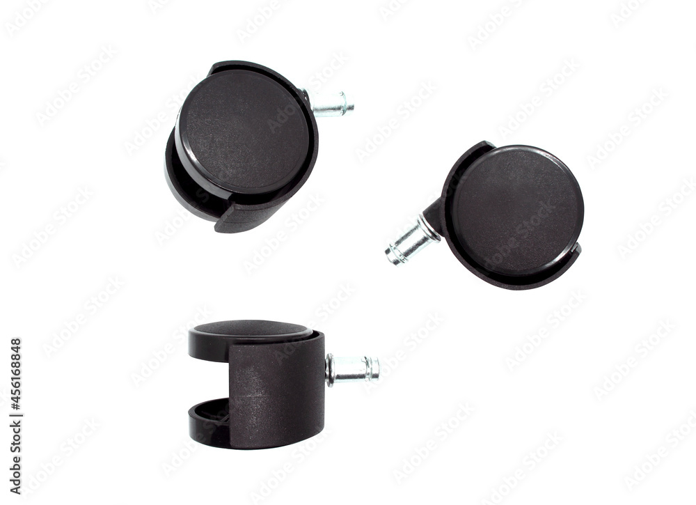 Plastic wheels for office or computer chair isolated on white background. Three black rolls for furniture. Wheels for floor. Close-up. Plastic wheels for office or computer chair isolated on white background. Three black rolls for furniture. Wheels for floor. Close-up.